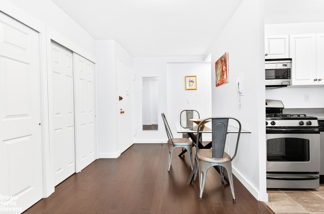 520 East 72nd Street, Unit 3G Manhattan, NY 10021 - Photo 5 of 15 a view of a dining room with furniture and wooden floor