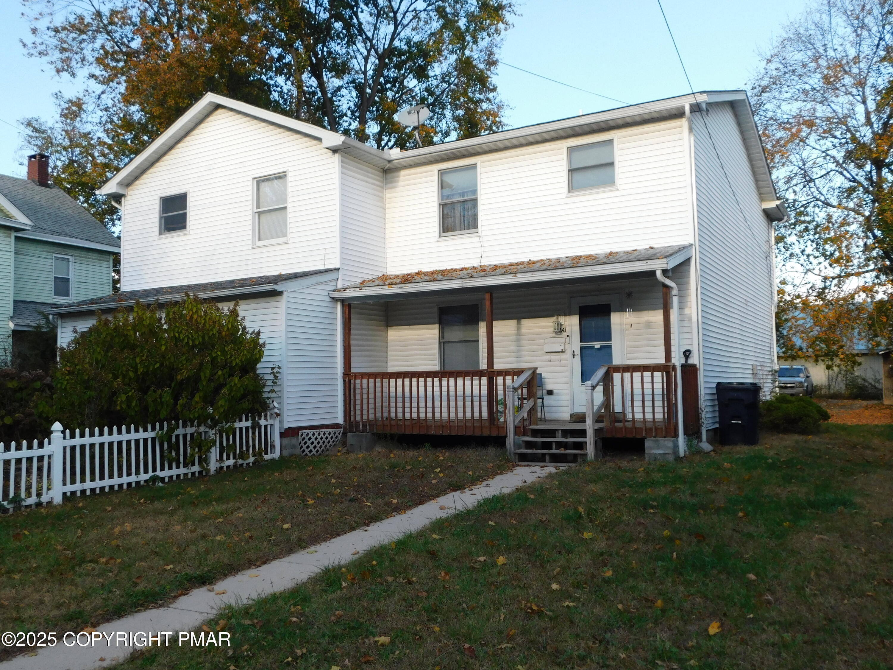 a view of a house with a yard and a garden