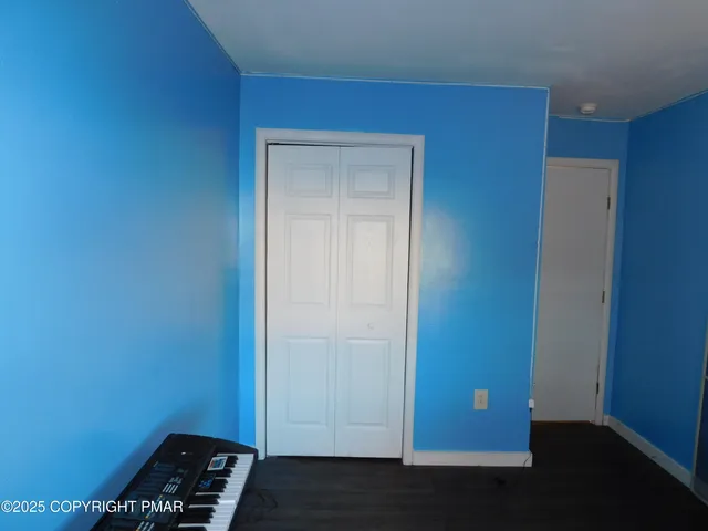 a bathroom with a sink vanity and toilet