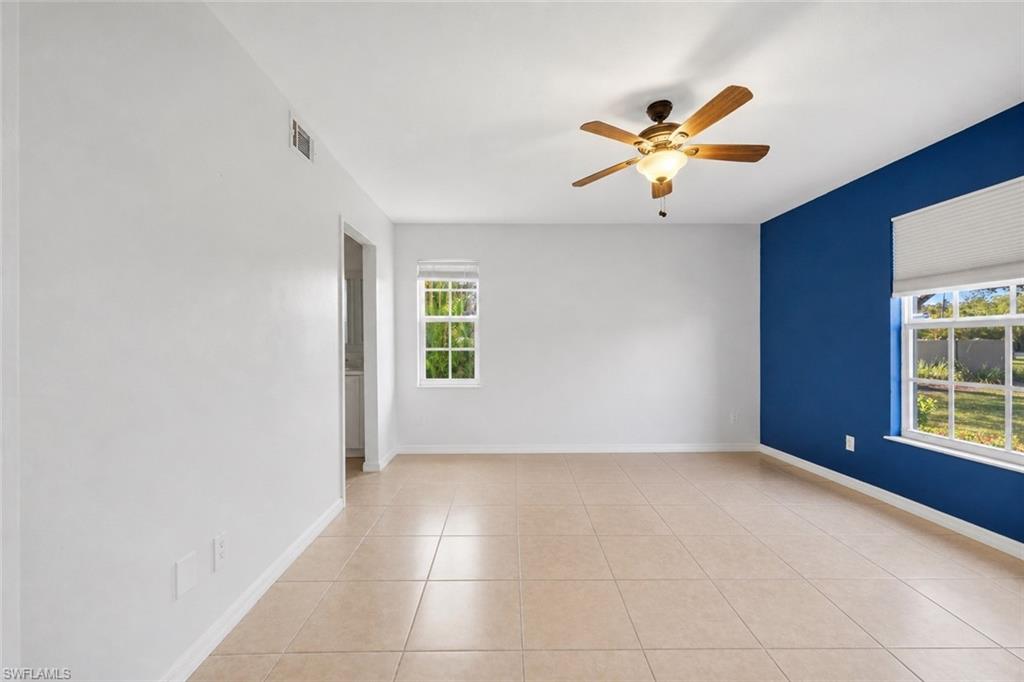 5737 Whitaker Road, Unit C101 Naples, FL 34112 - Photo 12 of 28 a view of an empty room with a window