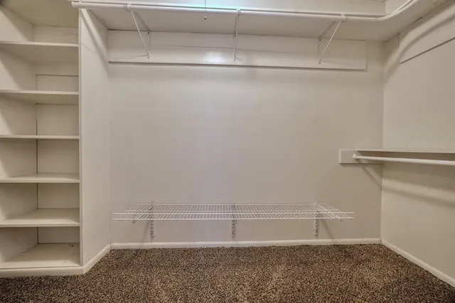 a view of an empty walk in closet