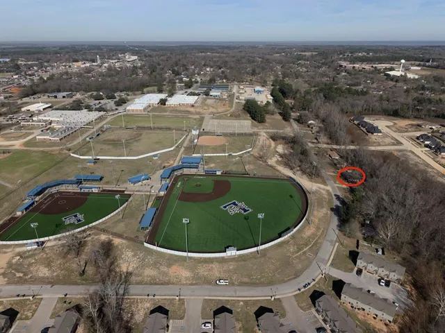 an aerial view of a house with outdoor space