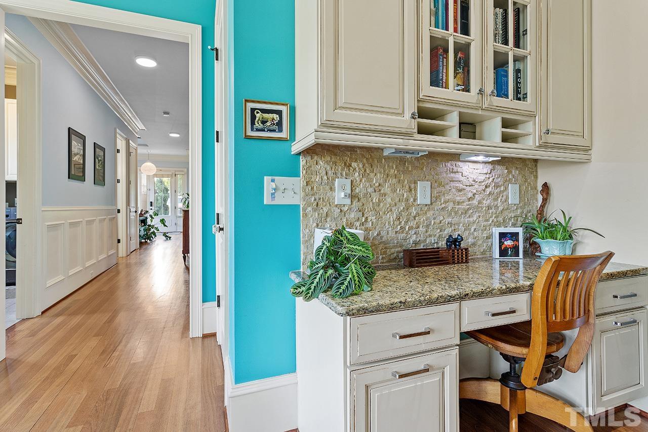 3100 Raymond Street Raleigh, NC 27607 - Photo 15 of 37 a kitchen with stainless steel appliances granite countertop a stove a sink and dishwasher with wooden floor