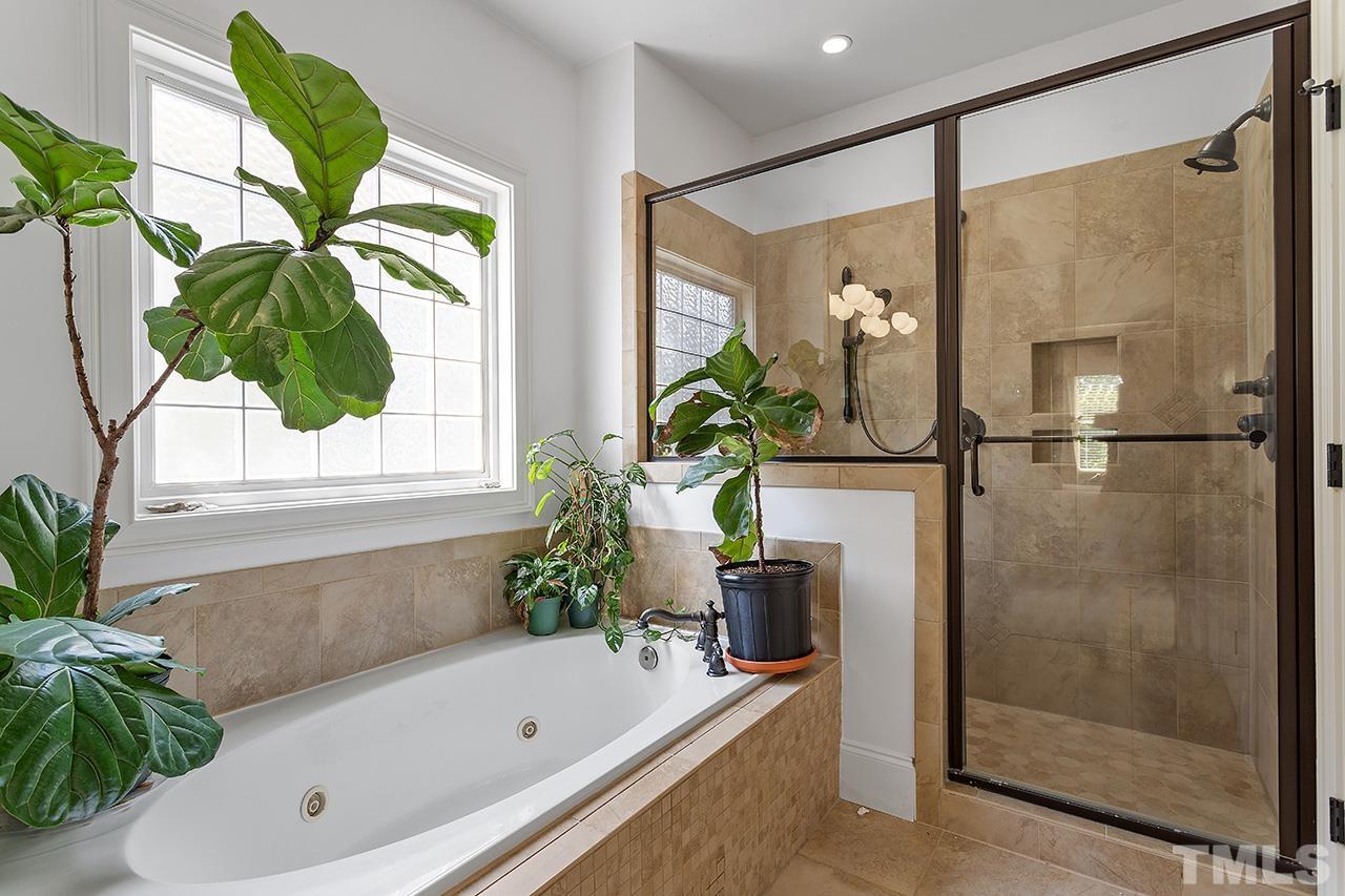 3100 Raymond Street Raleigh, NC 27607 - Photo 23 of 37 a bathroom with a tub and shower