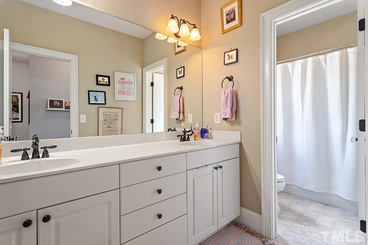 3100 Raymond Street Raleigh, NC 27607 - Photo 24 of 37 a bathroom with a double vanity sink mirror and bathtub