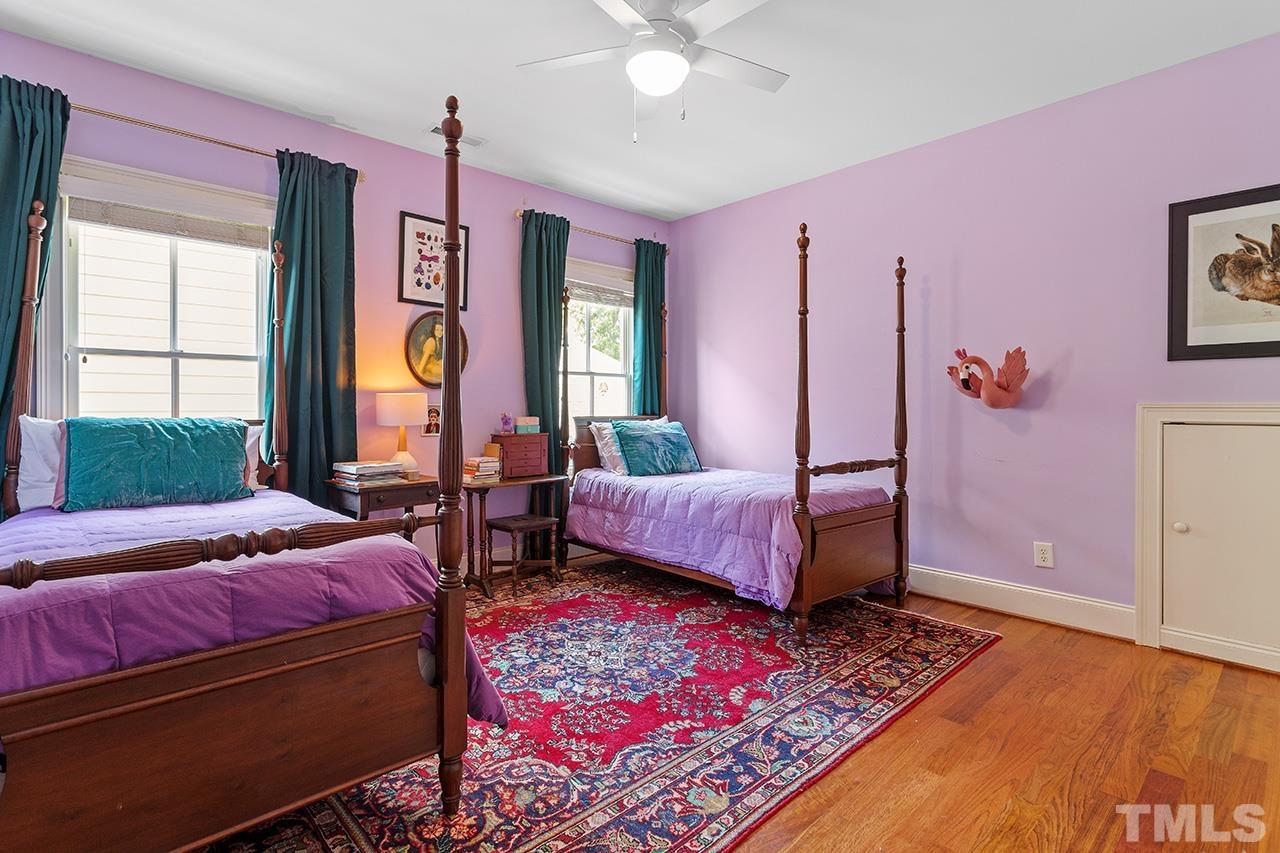 3100 Raymond Street Raleigh, NC 27607 - Photo 27 of 37 a spacious bedroom with a bed a dresser and a window