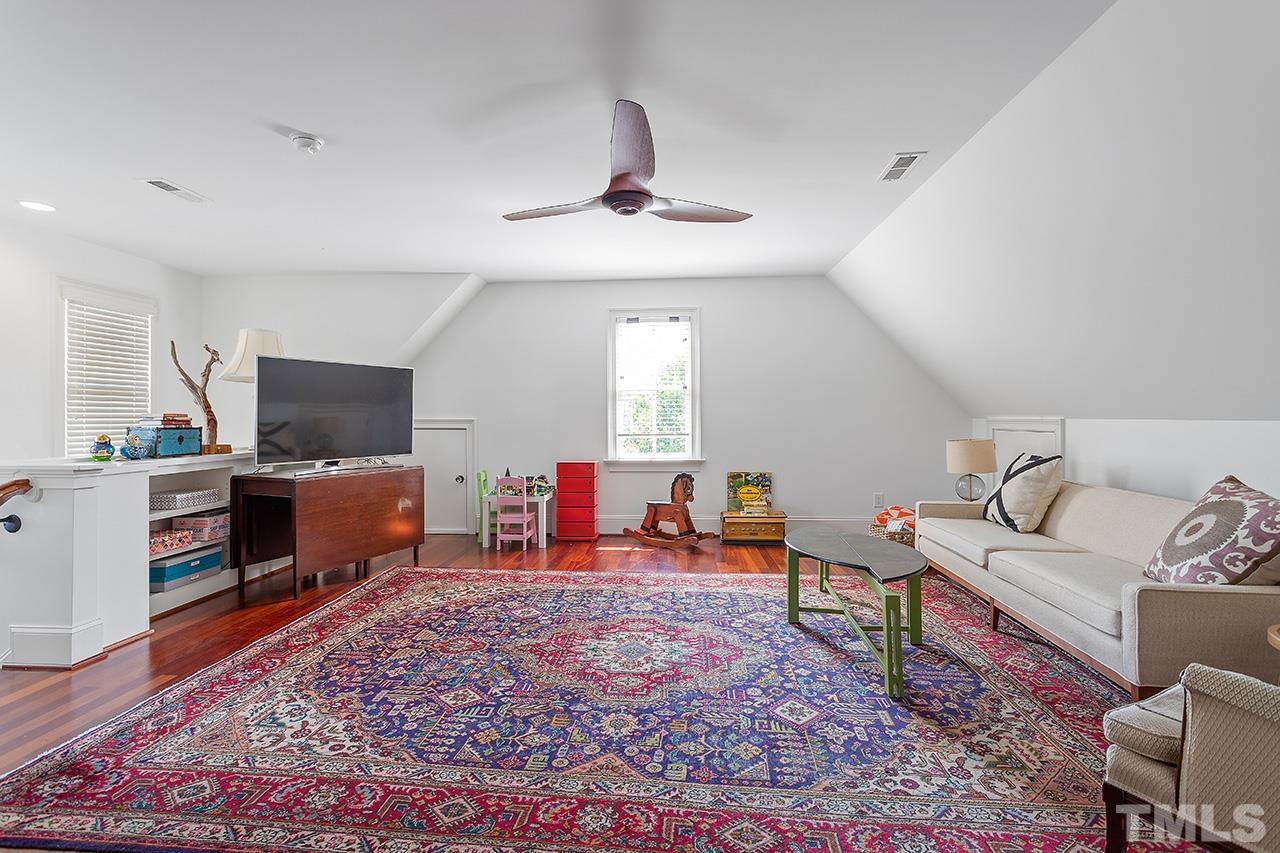 3100 Raymond Street Raleigh, NC 27607 - Photo 28 of 37 a living room with furniture and a flat screen tv