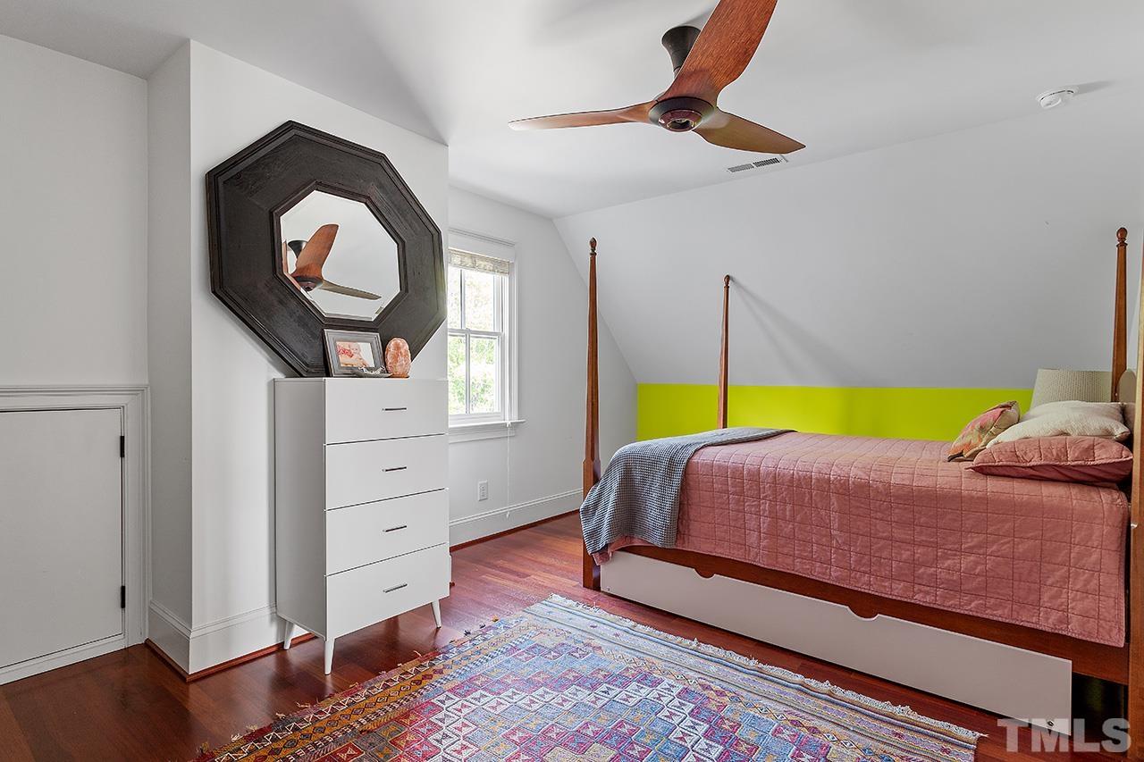 3100 Raymond Street Raleigh, NC 27607 - Photo 29 of 37 a bedroom with a bed and a dresser