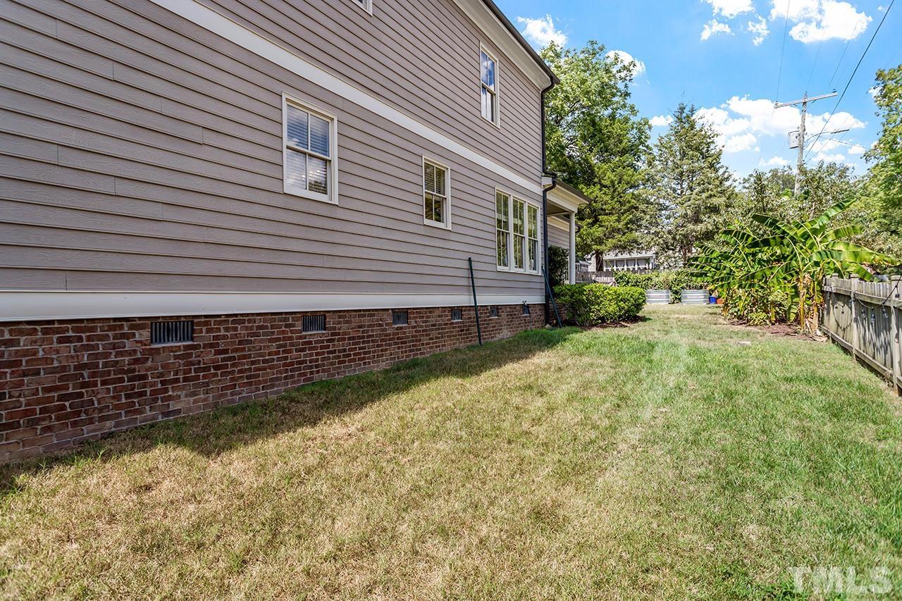 3100 Raymond Street Raleigh, NC 27607 - Photo 34 of 37 a view of a backyard with plants and large tree