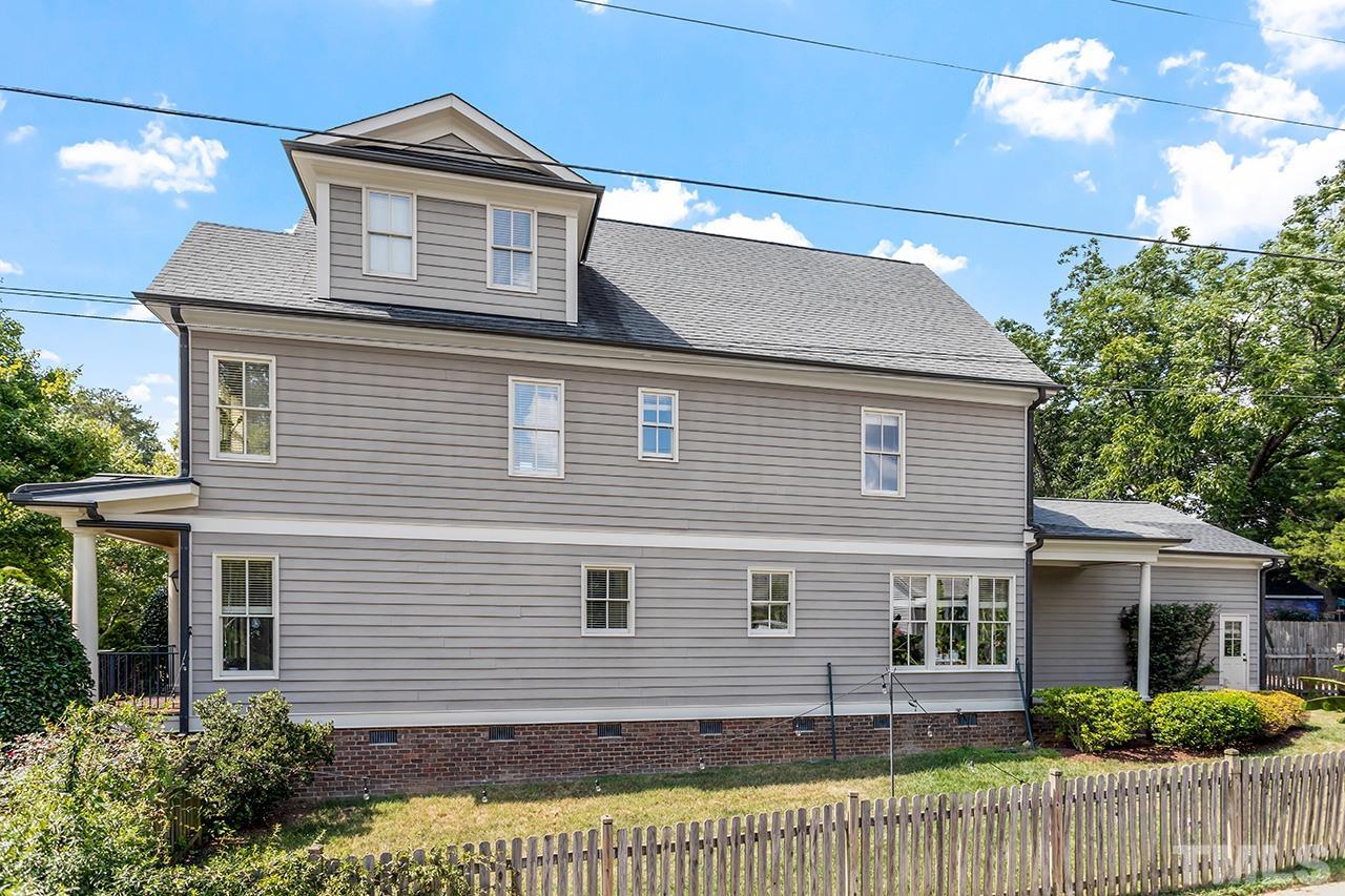 3100 Raymond Street Raleigh, NC 27607 - Photo 35 of 37 a front view of a house with a garden