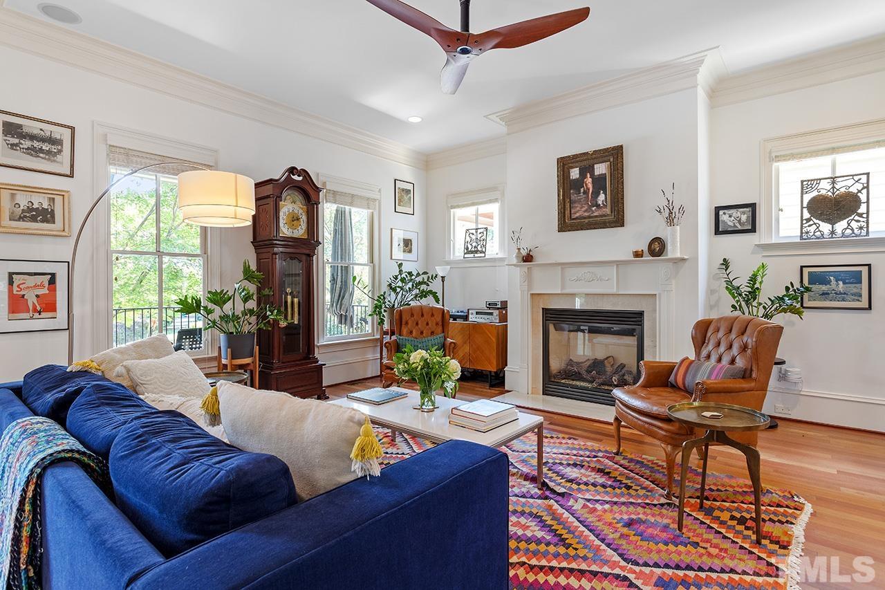 3100 Raymond Street Raleigh, NC 27607 - Photo 6 of 37 a living room with furniture fireplace and a large window