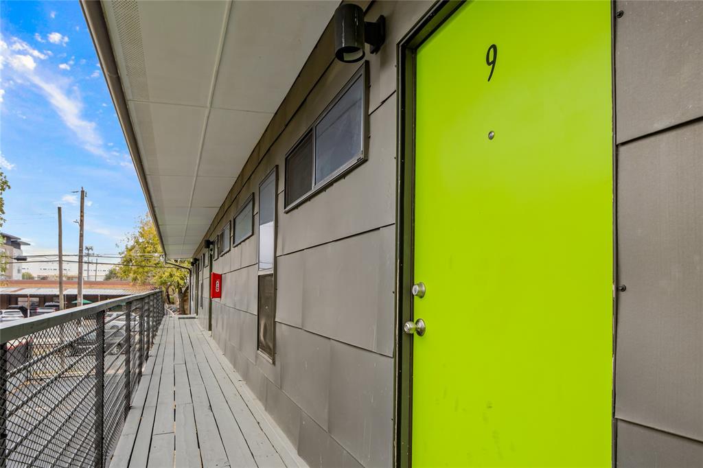 1804 Gould Street, Unit 9 Dallas, TX 75215 - Photo 12 of 12 a view of a balcony with wooden floor