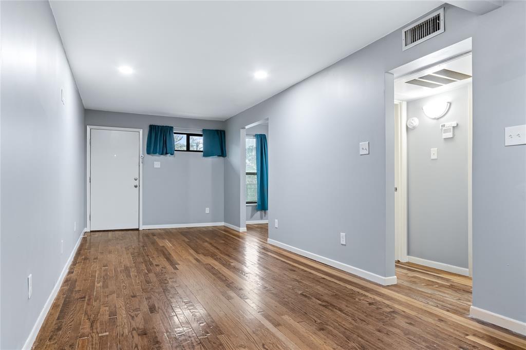 1804 Gould Street, Unit 9 Dallas, TX 75215 - Photo 2 of 12 a view of a livingroom with wooden floor