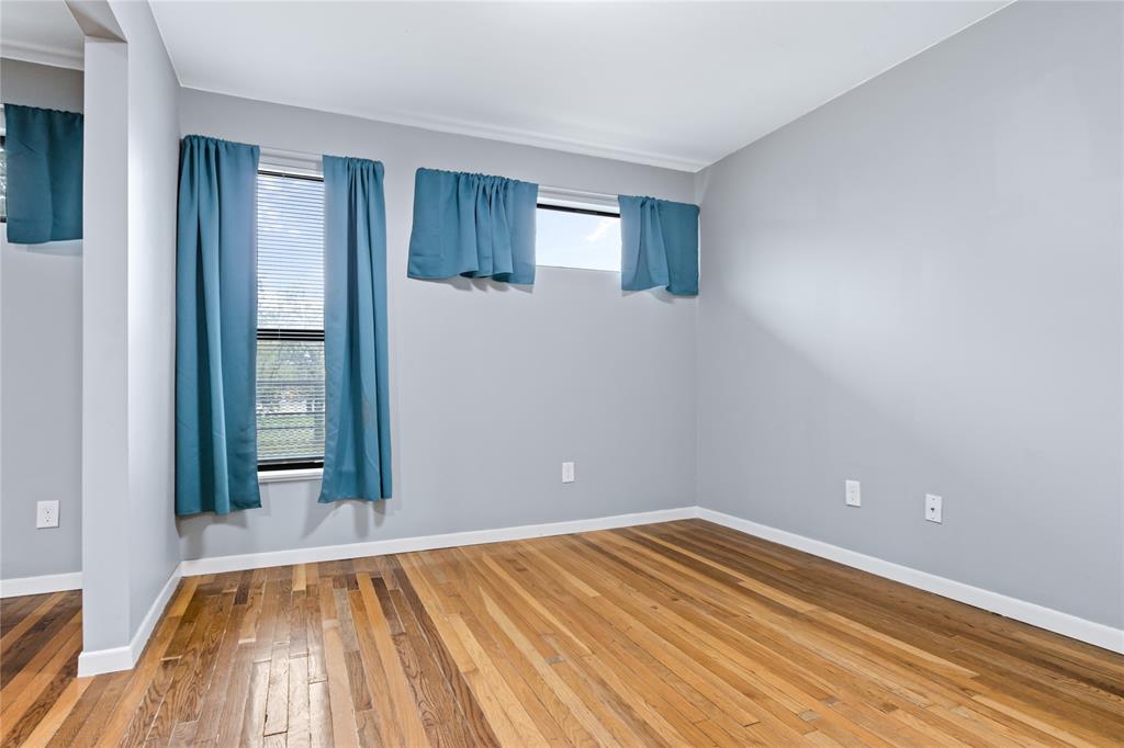 1804 Gould Street, Unit 9 Dallas, TX 75215 - Photo 3 of 12 a view of empty room with wooden floor