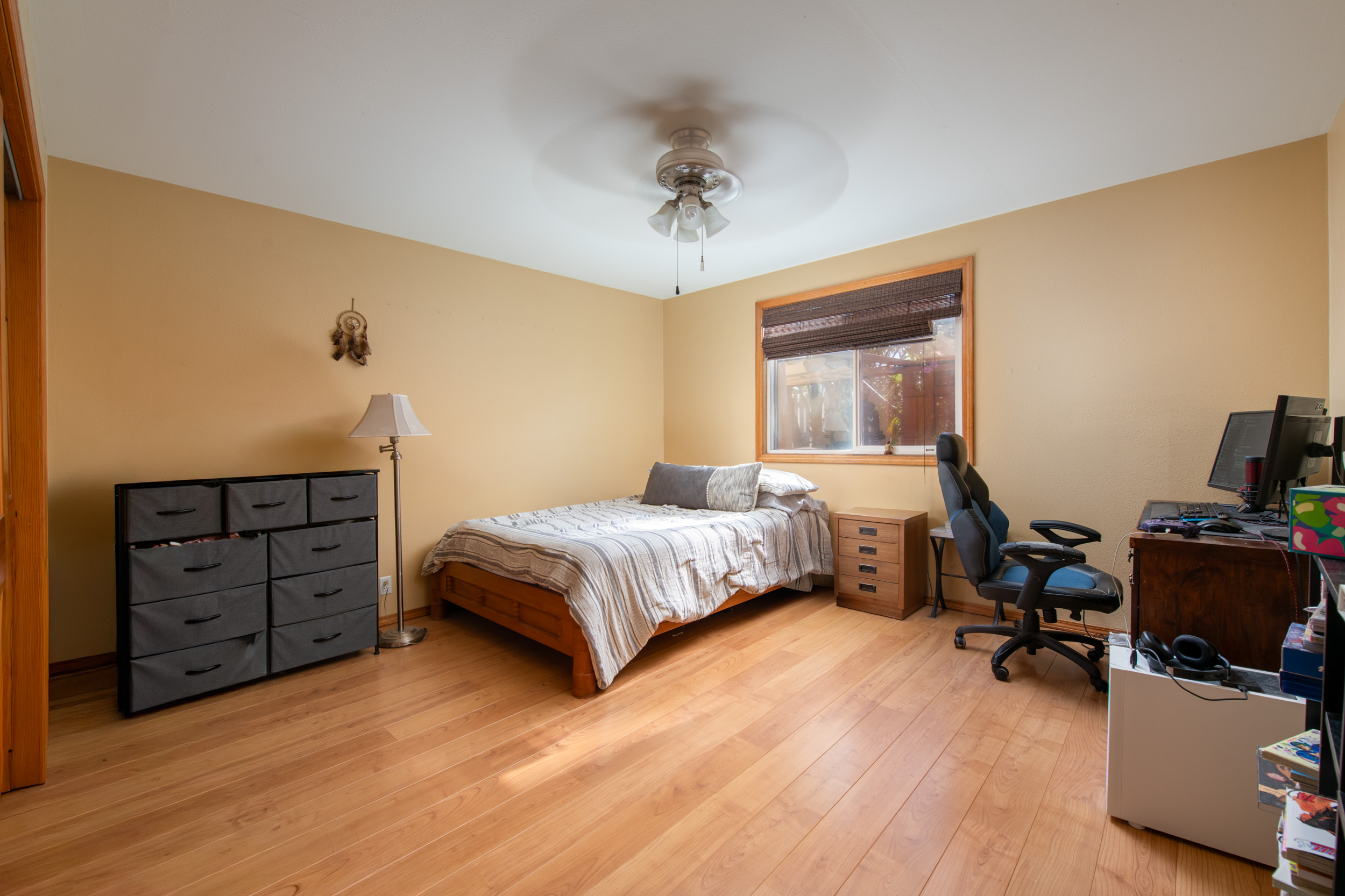 68-1655 Alana Street Waikoloa, HI 96738 - Photo 12 of 20 a bedroom with a bed and a chandelier