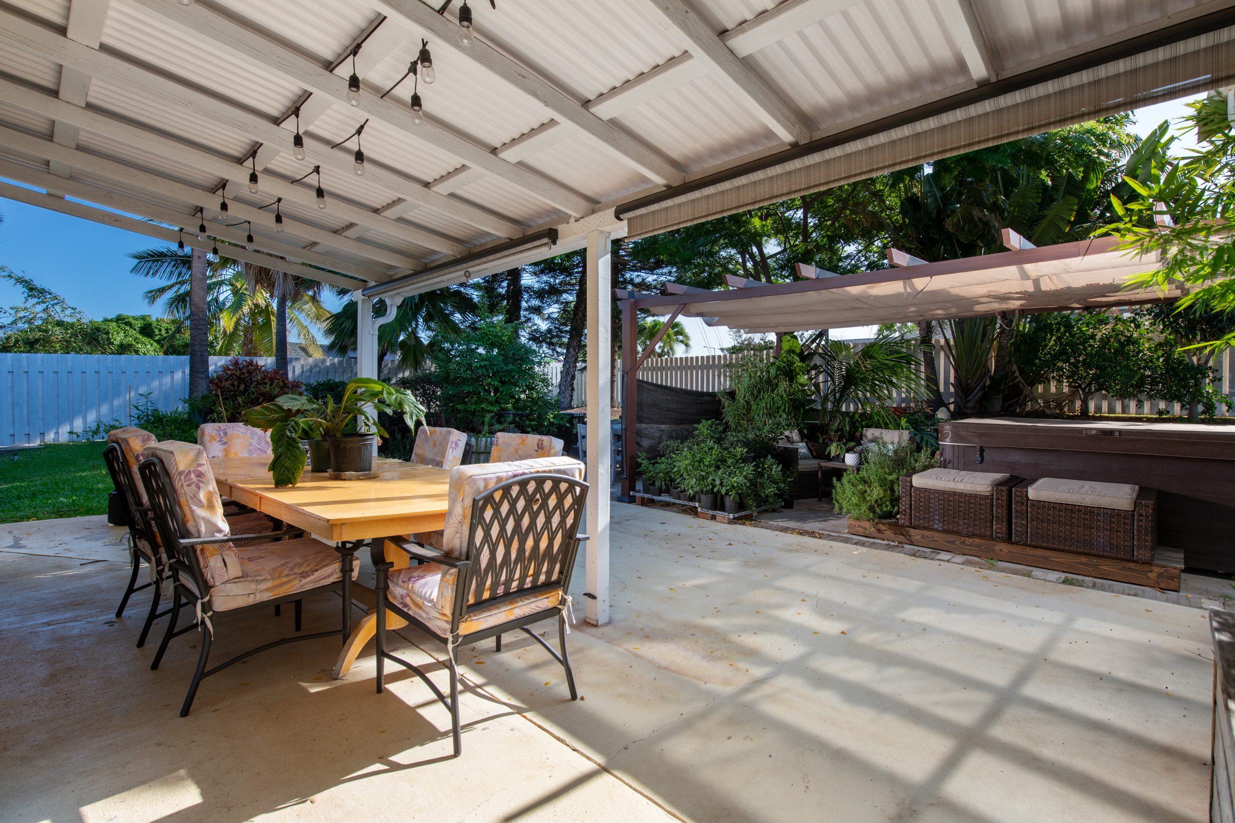 68-1655 Alana Street Waikoloa, HI 96738 - Photo 13 of 20 a view of a patio with a table chairs and a backyard