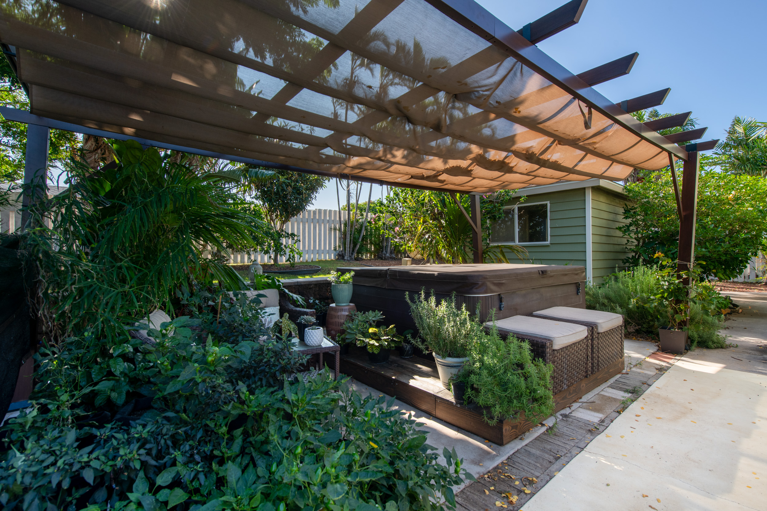 68-1655 Alana Street Waikoloa, HI 96738 - Photo 15 of 20 a view of a patio with table and chairs and potted plants