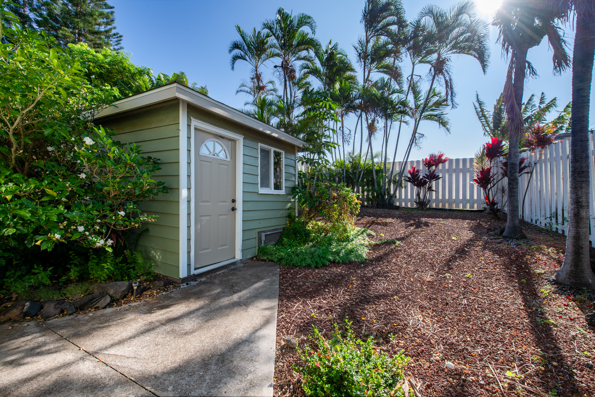 68-1655 Alana Street Waikoloa, HI 96738 - Photo 17 of 20 a front view of a house with a garden