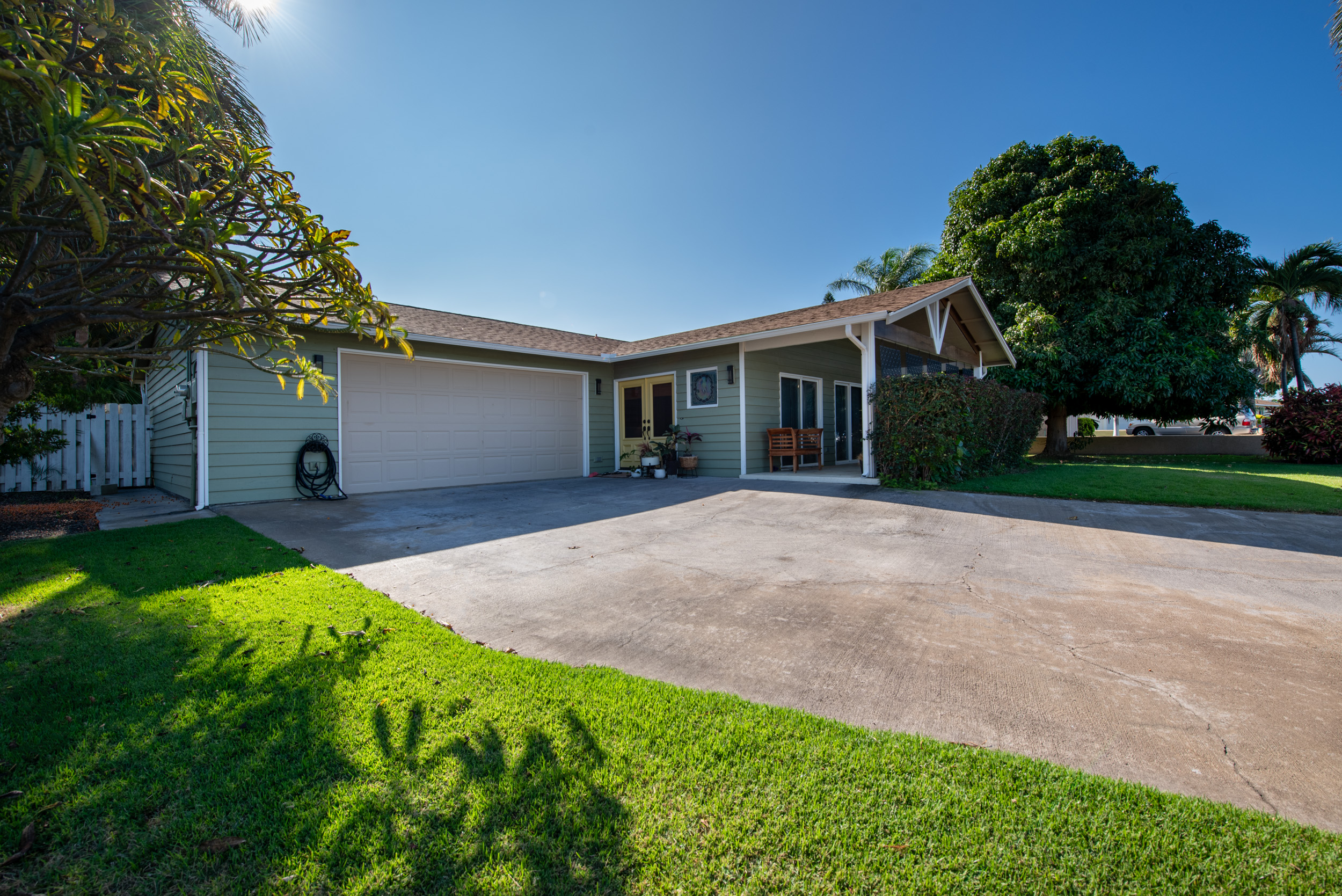 68-1655 Alana Street Waikoloa, HI 96738 - Photo 18 of 20 a view of a house with a yard and potted plants