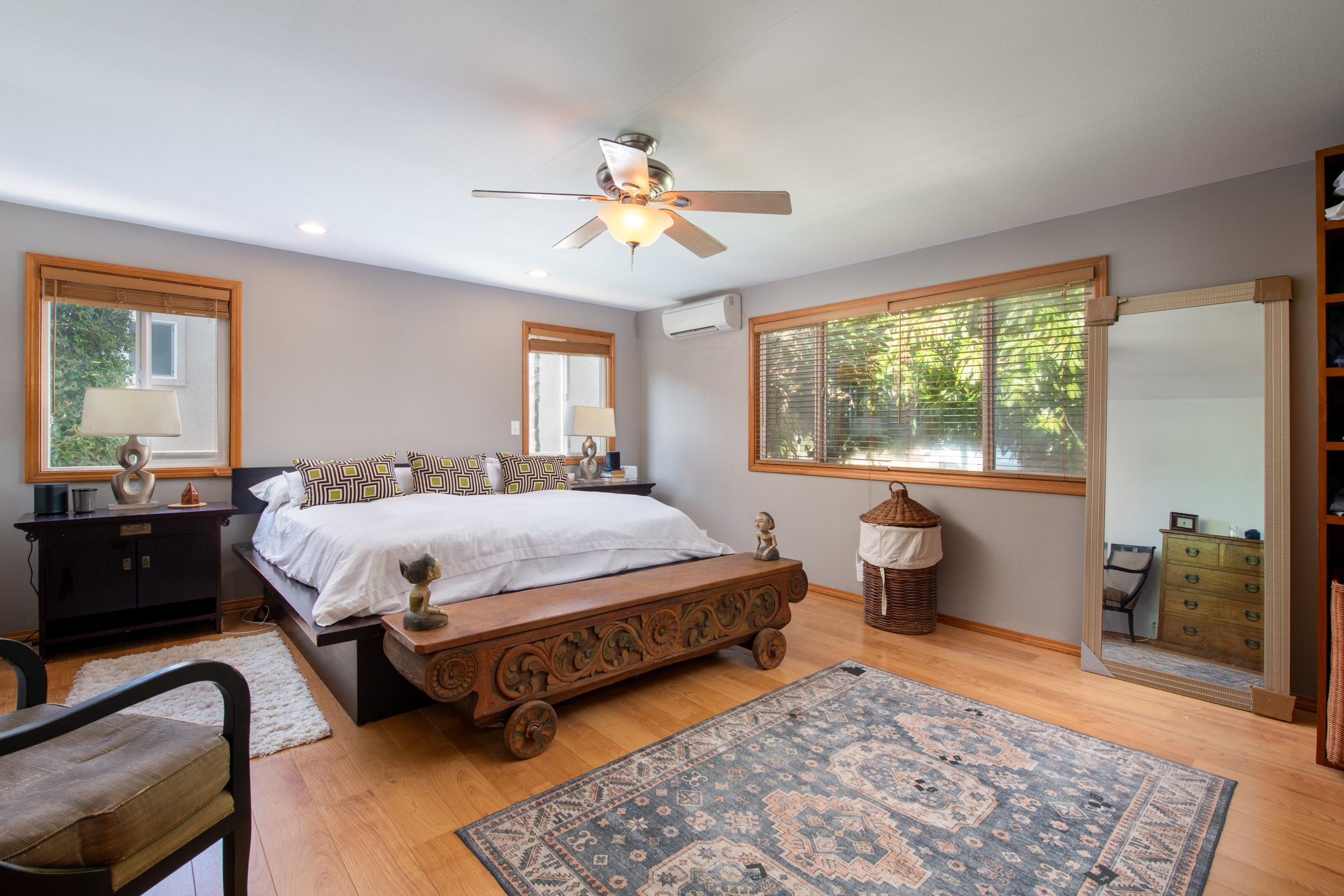 68-1655 Alana Street Waikoloa, HI 96738 - Photo 8 of 20 a spacious bedroom with a bed and wooden floor