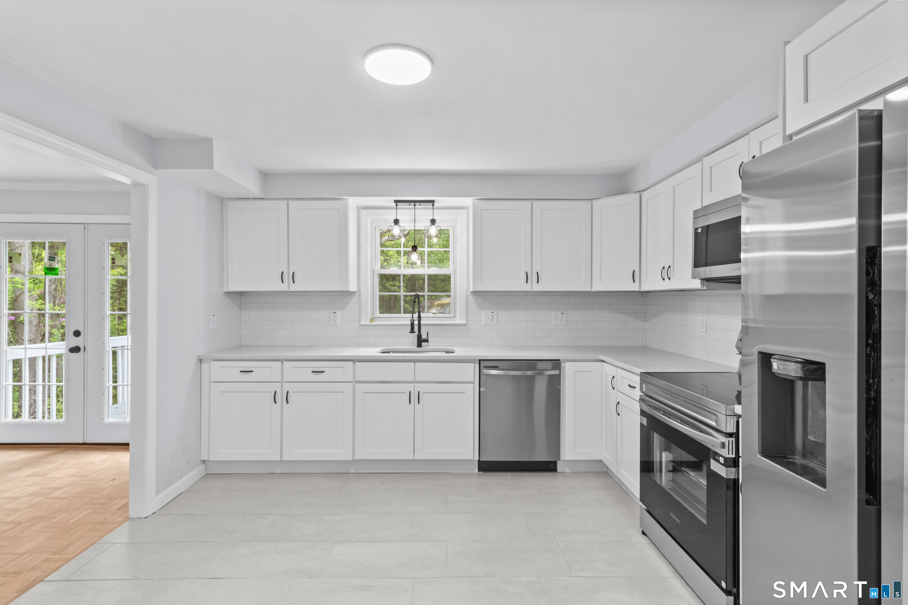 20 Quiet Woods Road East Hampton, CT 06424 - Photo 2 of 40 a kitchen with granite countertop stainless steel appliances and white cabinets