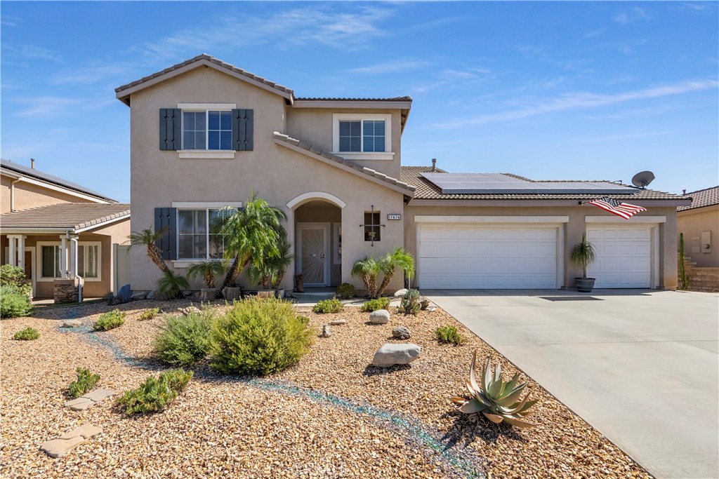 17876 Robusta Drive Riverside, CA 92503 - Photo 1 of 1 a front view of a house with a yard