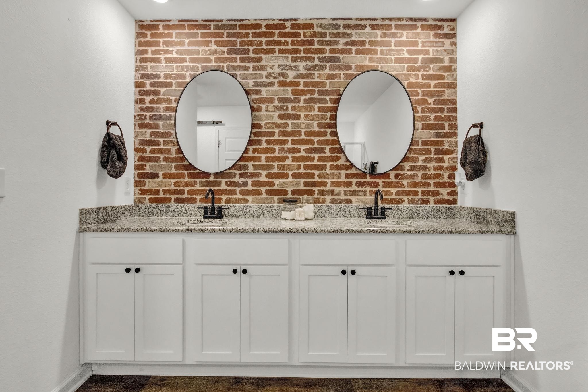 23810 Unbridled Loop Daphne, AL 36526 - Photo 20 of 50 Dual Vanities accented by upgraded hardware and brick accent wall