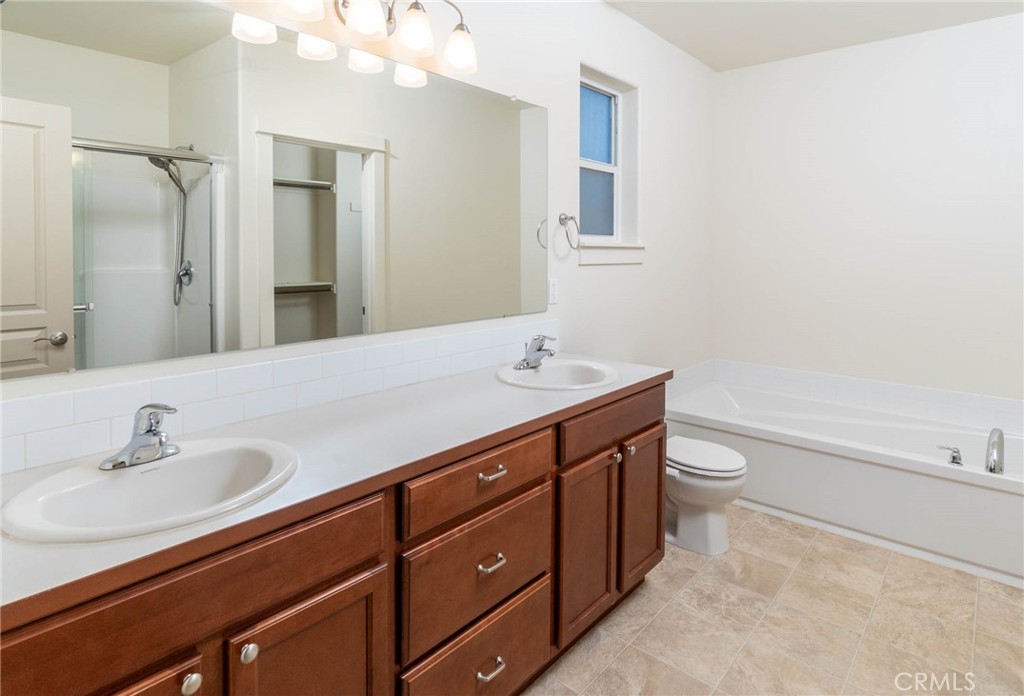 3667 Southwest Pumice Stone Avenue Redmond, OR 97756 - Photo 9 of 13 a bathroom with a sink a toilet and shower