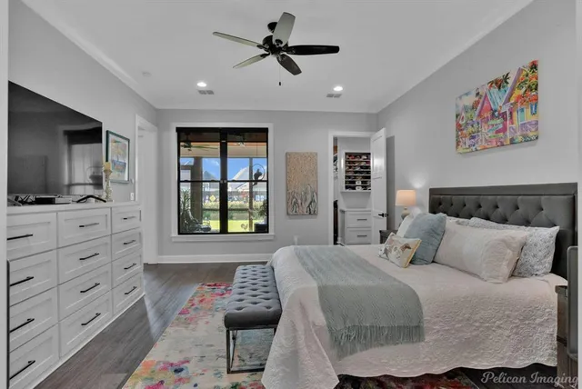 a bedroom with a bed and flat screen tv