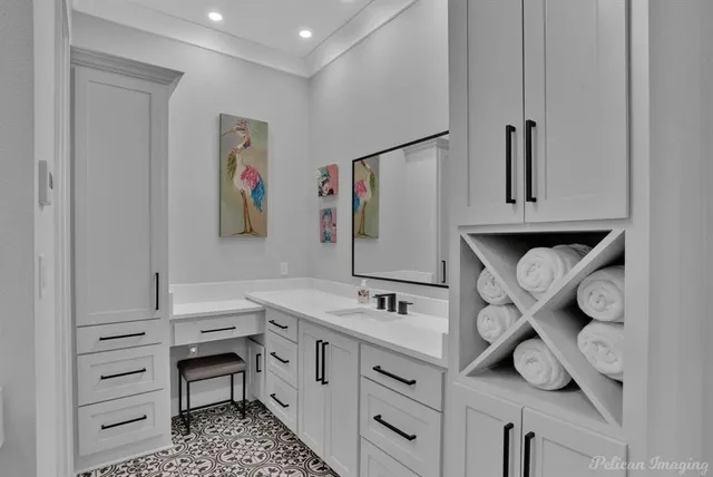 a bathroom with a double vanity sink a mirror a bathtub and shower