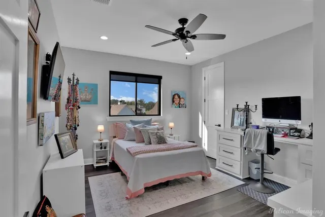 a living room with furniture and a book shelf