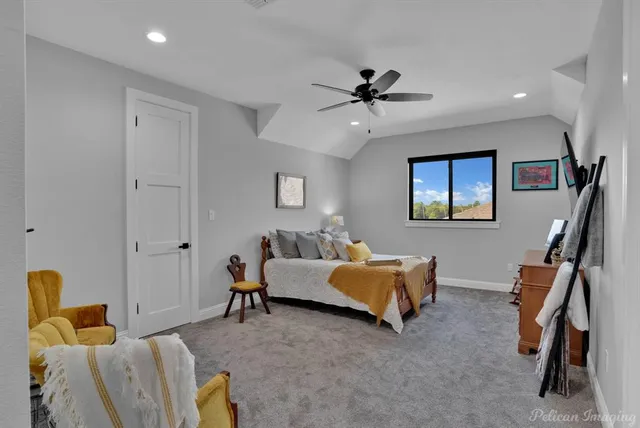 a bathroom with a sink mirror vanity and toilet
