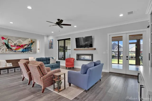 a living room with fireplace furniture and a flat screen tv