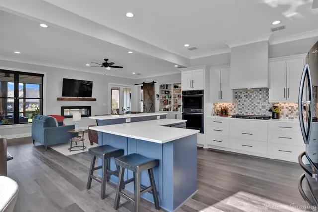 a view of a house with a yard and fence