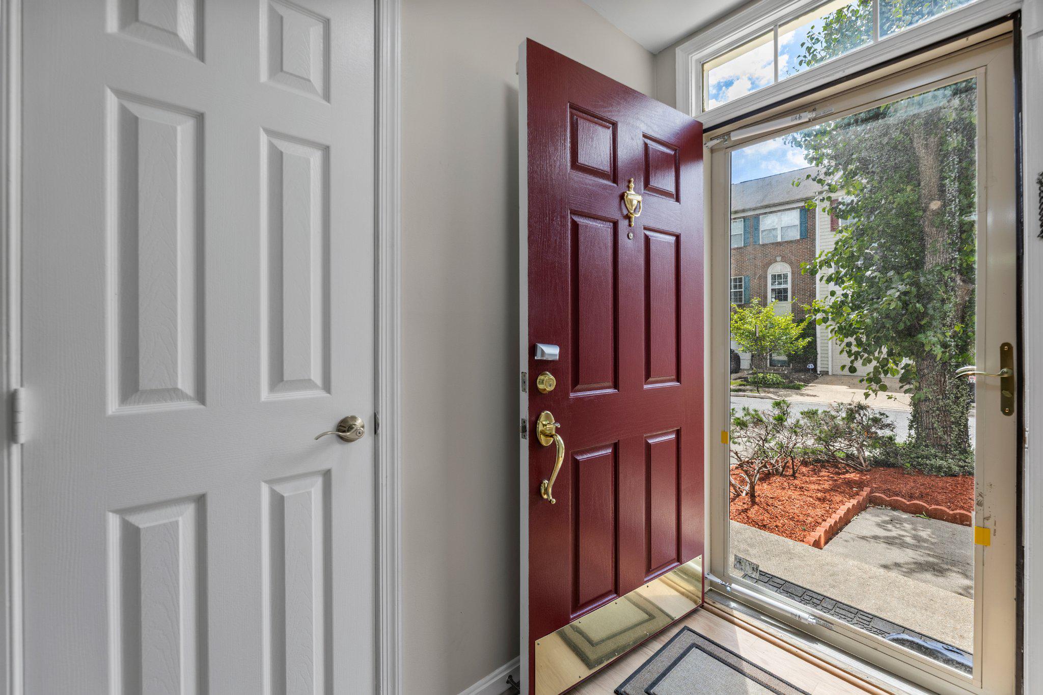 9241 Lorton Valley Road Lorton, VA 22079 - Photo 5 of 45 Welcoming entry-vibrant red door & storm door.
