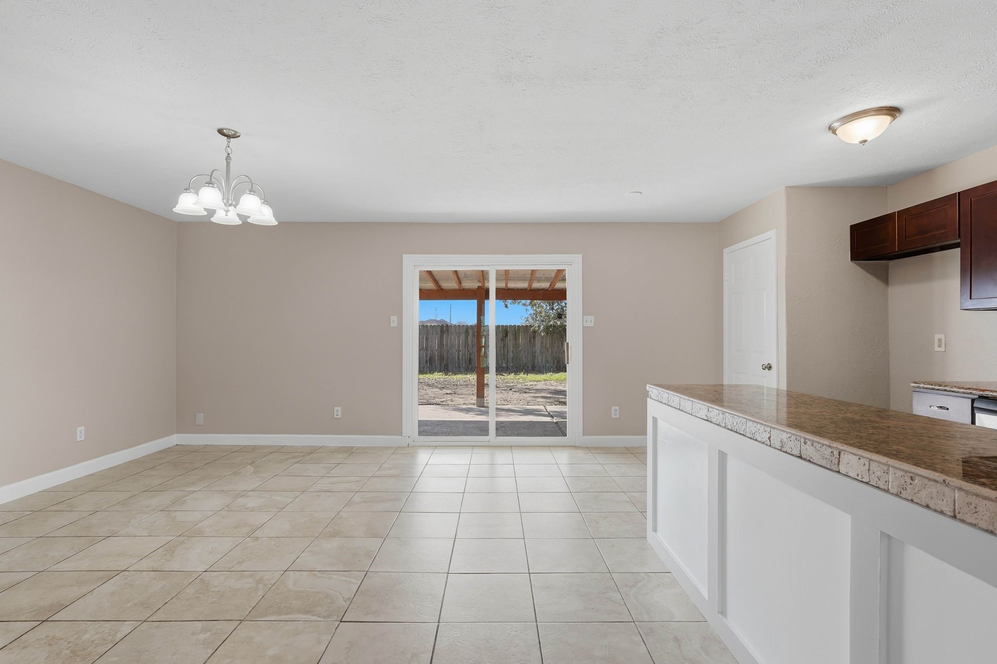 17223 Ranch Country Road Hockley, TX 77447 - Photo 10 of 36 Welcome to your massive, open formal dining room area and kitchen with a view into your scenic backyard.