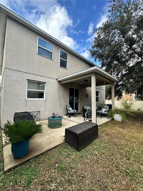 1102 Lake Highview Lane Brandon, FL 33510 - Photo 1 of 1 a view of a house with backyard sitting area and porch