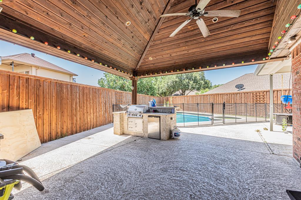 300 Sundance Circle Irving, TX 75063 - Photo 32 of 39 Covered patio featuring a wood-plank ceiling, ceiling fan, and recessed lighting