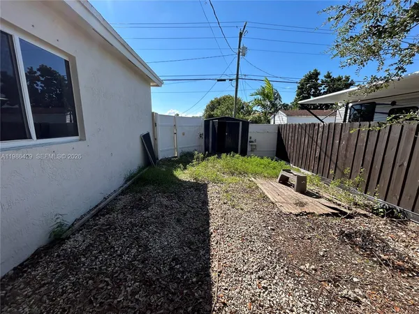 a view of a backyard with a tub