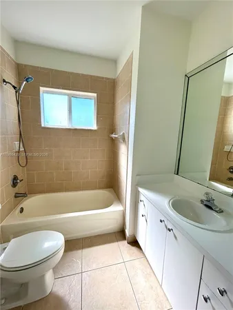 a bathroom with a sink a toilet and a bathtub