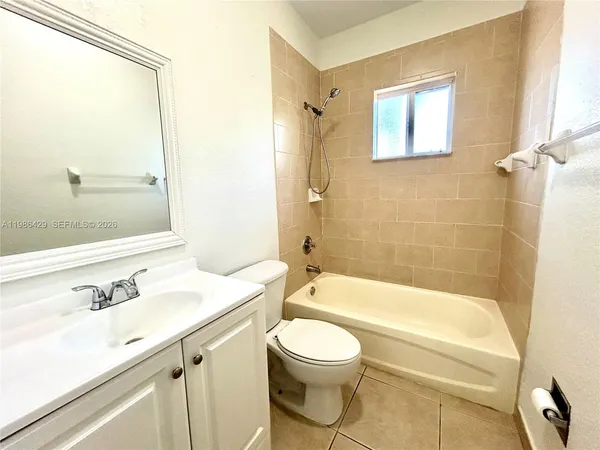 a bathroom with a sink a toilet and a bathtub