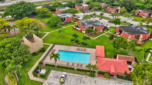 an aerial view of house with yard swimming pool and outdoor seating