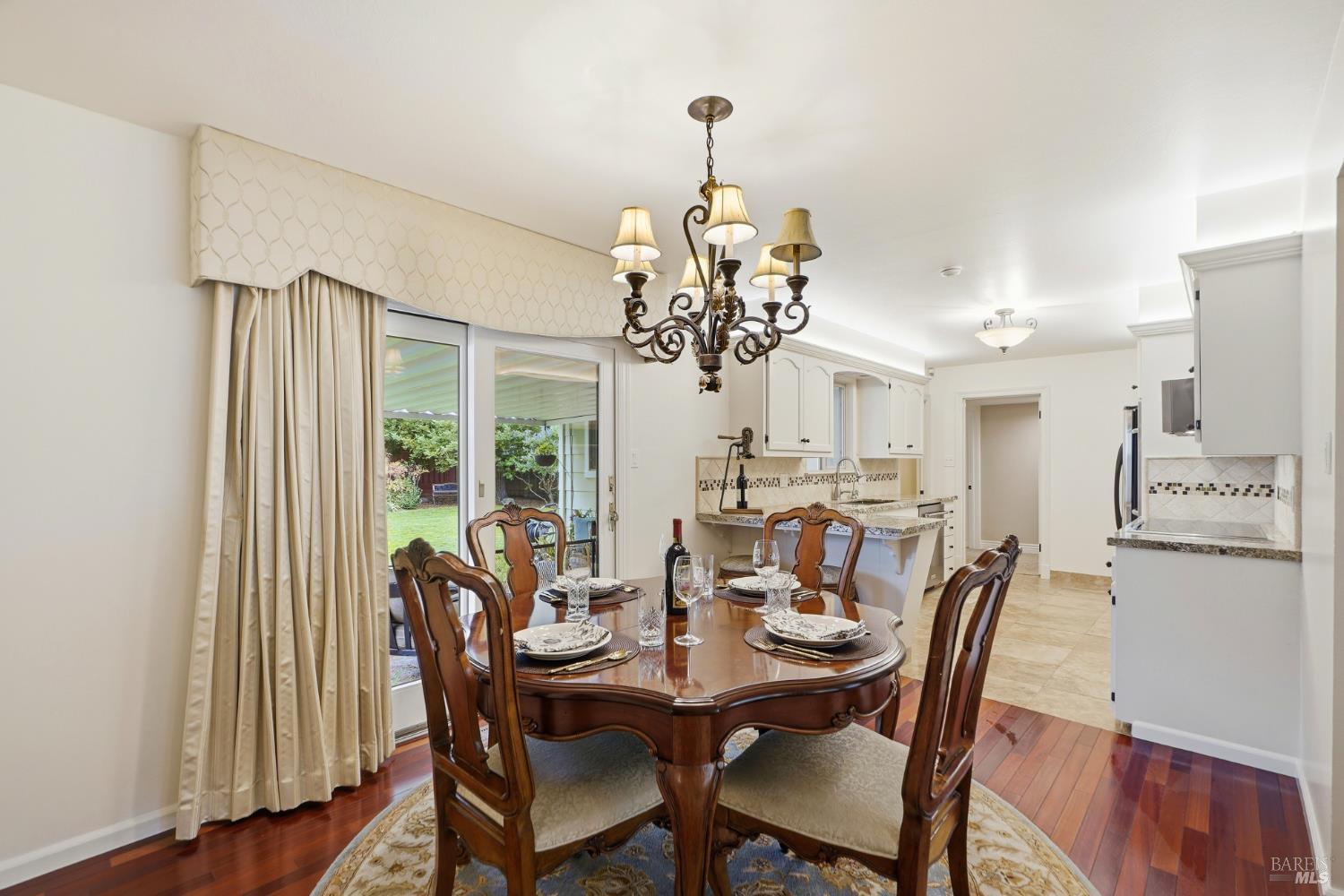 373 Piezzi Road Santa Rosa, CA 95401 - Photo 18 of 55 a view of a dining room with furniture wooden floor and chandelier