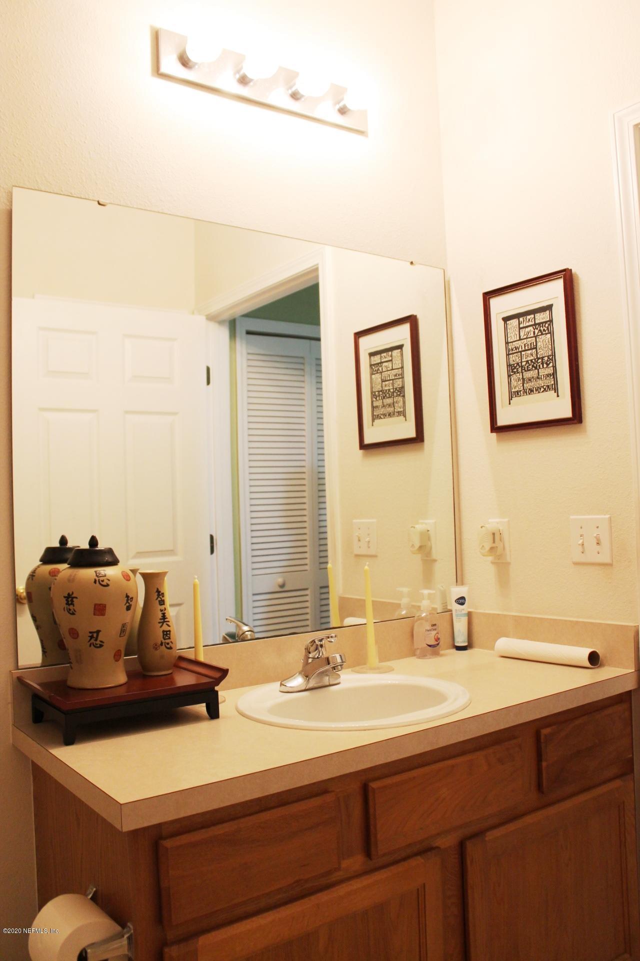 3680 Kirkpatrick Circle, Unit 3 Jacksonville, FL 32210 - Photo 11 of 29 a bathroom with a sink and a mirror