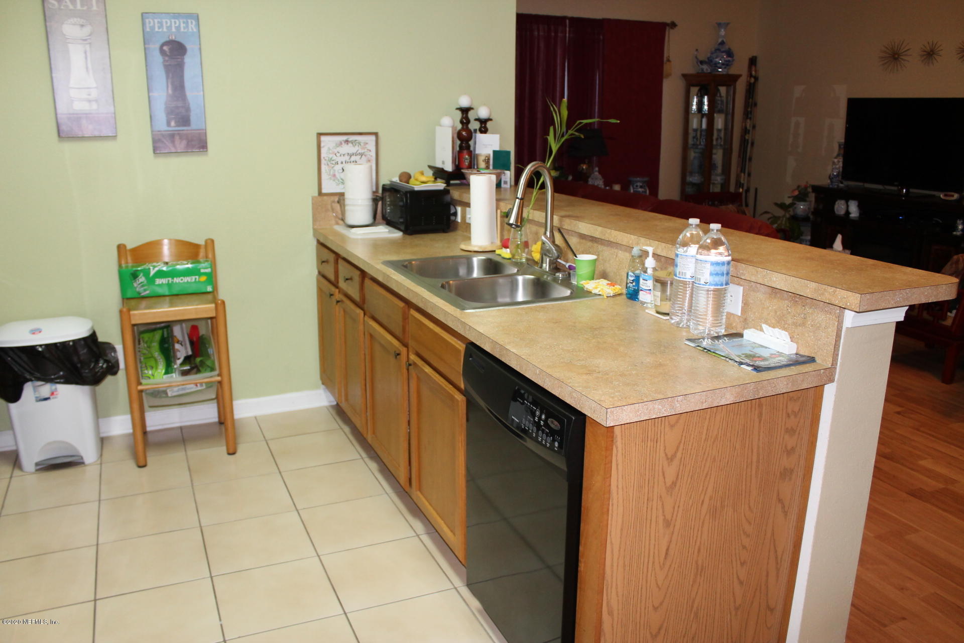 3680 Kirkpatrick Circle, Unit 3 Jacksonville, FL 32210 - Photo 14 of 29 a kitchen with a sink a counter top space and cabinets