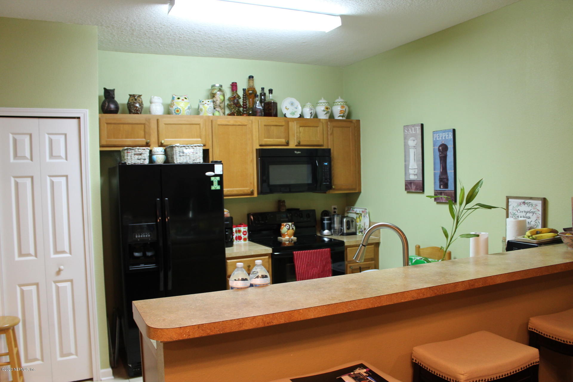 3680 Kirkpatrick Circle, Unit 3 Jacksonville, FL 32210 - Photo 16 of 29 a kitchen with a table and chairs in it