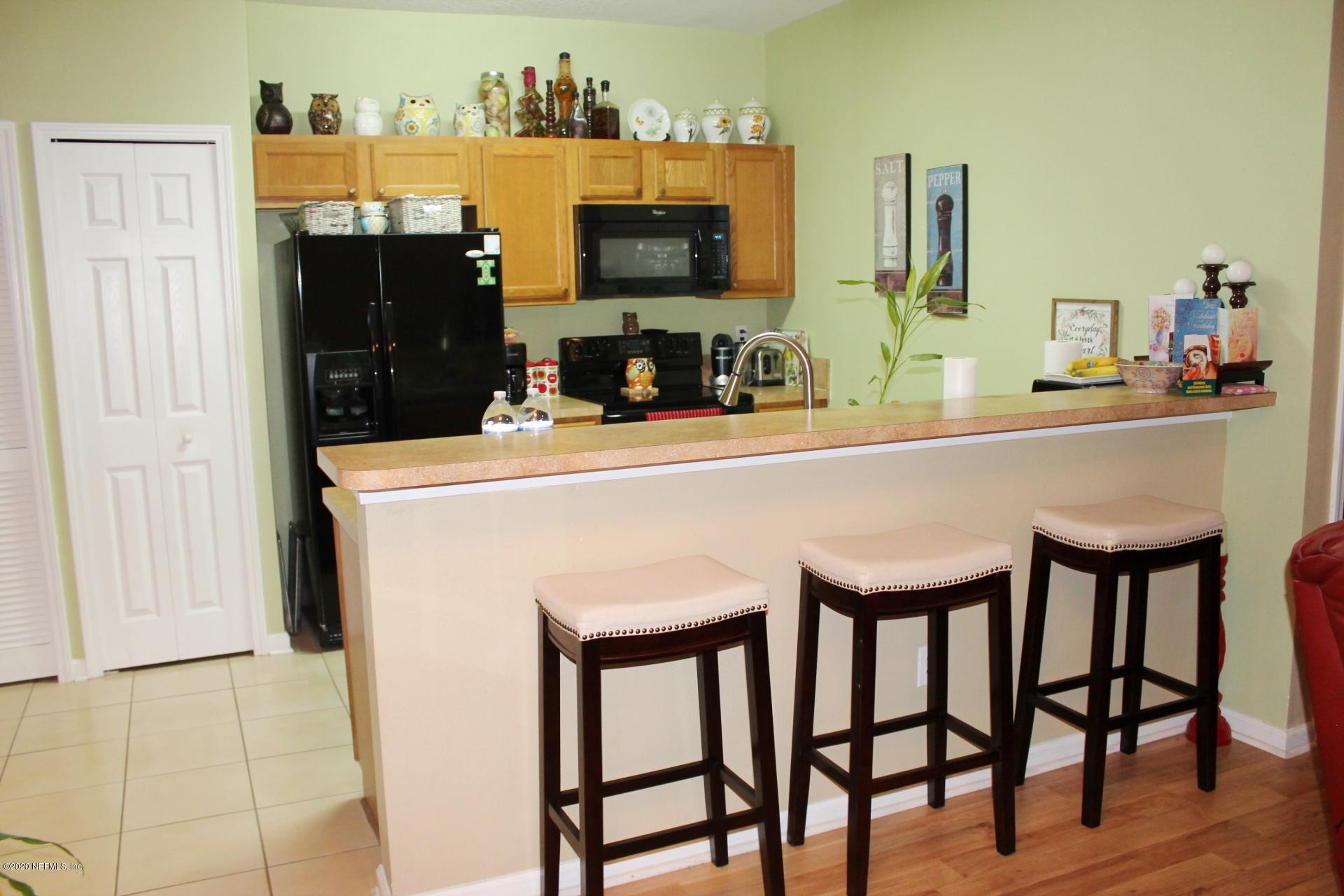 3680 Kirkpatrick Circle, Unit 3 Jacksonville, FL 32210 - Photo 17 of 29 a dining room with a table and chairs