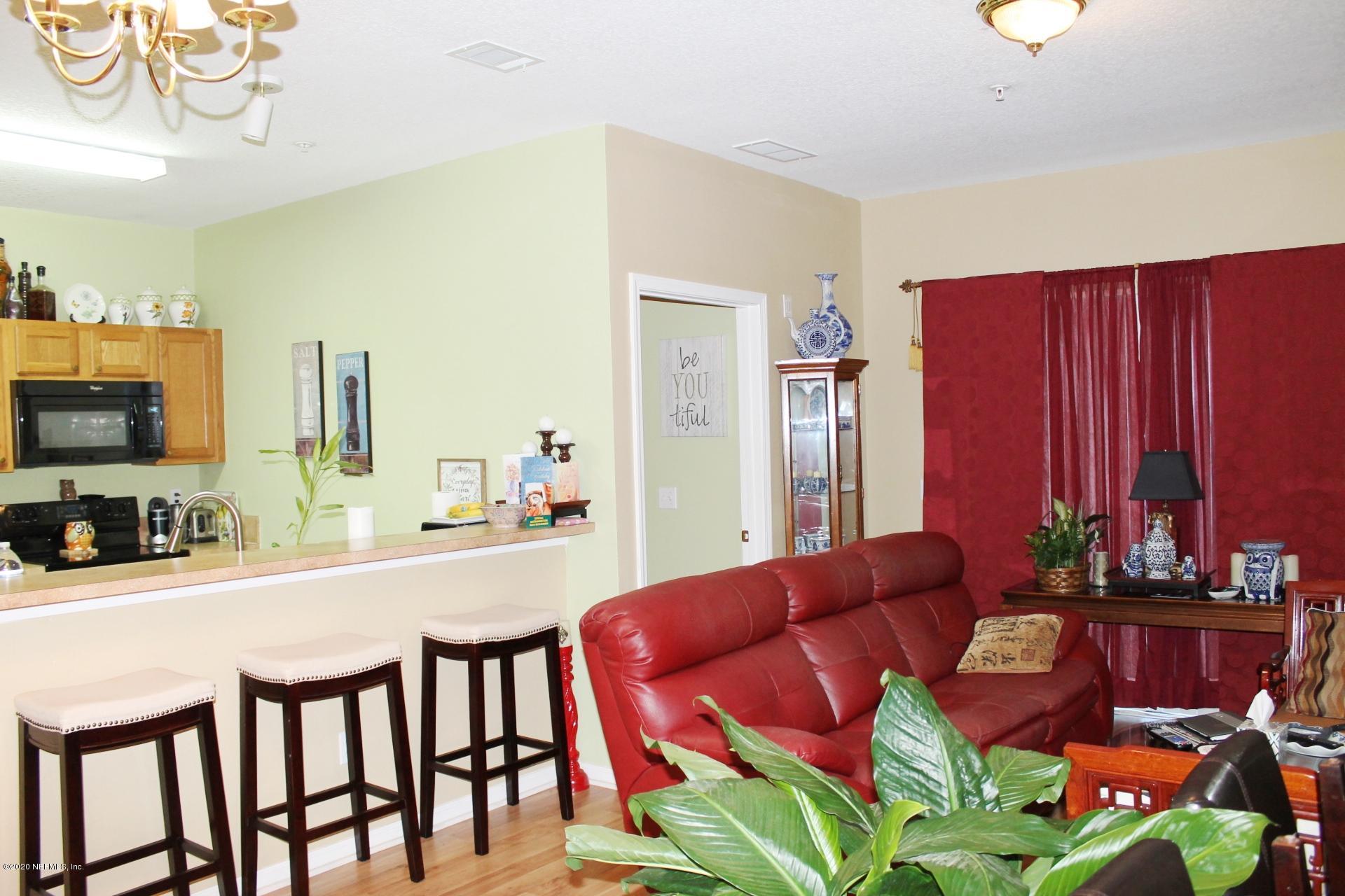 3680 Kirkpatrick Circle, Unit 3 Jacksonville, FL 32210 - Photo 18 of 29 a view of a dining room with furniture and a kitchen