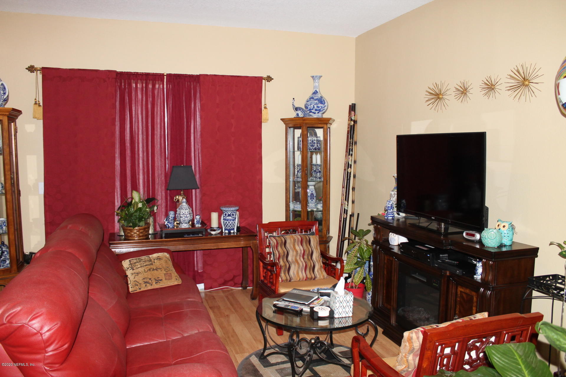 3680 Kirkpatrick Circle, Unit 3 Jacksonville, FL 32210 - Photo 19 of 29 a living room with furniture and a flat screen tv