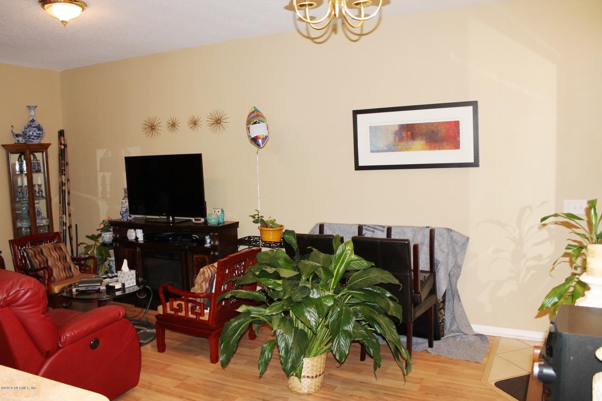 3680 Kirkpatrick Circle, Unit 3 Jacksonville, FL 32210 - Photo 21 of 29 a living room with furniture and a flat screen tv